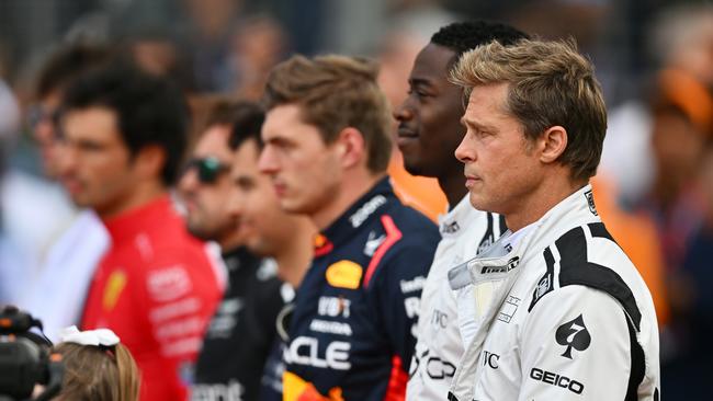 Brad Pitt and Damon Idris stand next to the real F1 drivers as part of filming for Apex at last year’s British Grand Prix. (Photo by Dan Mullan/Getty Images)