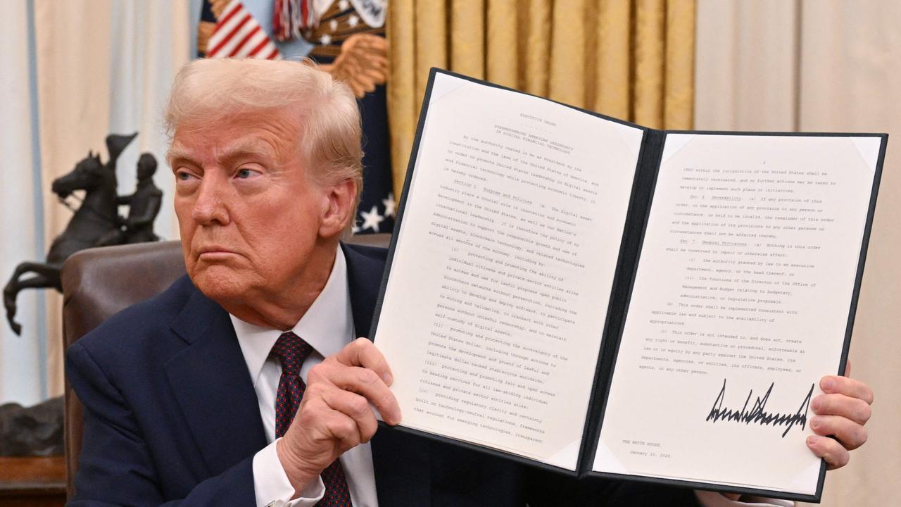 Donald Trump signs executive orders in the White House. Picture: Roberto Schmidt/AFP