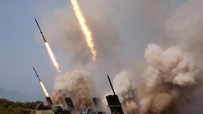 Rocket launchers fire during a test of weapons in an undisclosed location in North Korea. Picture: AFP