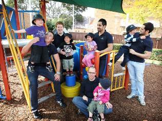 Male childcare workers pictured with kids at Top Ryde Early Learning Centre today. (L-R) Dylan O'Neil 4, Matthew Hochstulter, Tom Isaacs, Koby Ternal 3, Jinna Kim 4, Benjamin Vengoa, Lachlan Hubbard 4, Shaun Vengoa, and front Bryn Williams and Olivia O'Neil 3. Picture: Tim Hunter