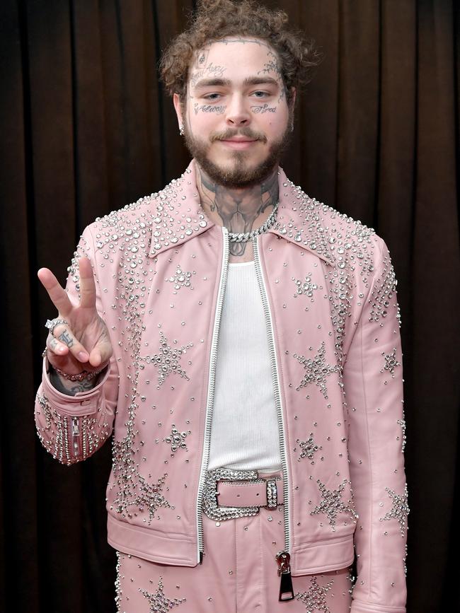 Post Malone attends the Grammys in a baby pink blinged-up outfit. Picture: Getty