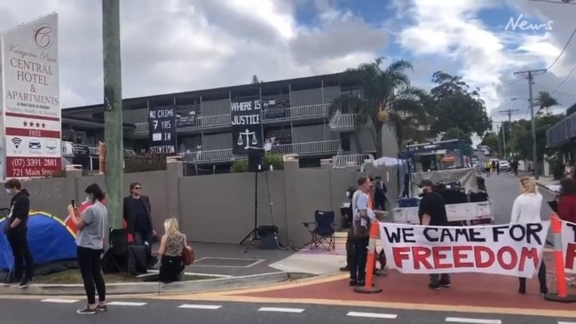 Protesters close streets outside a Brisbane refugee hotel