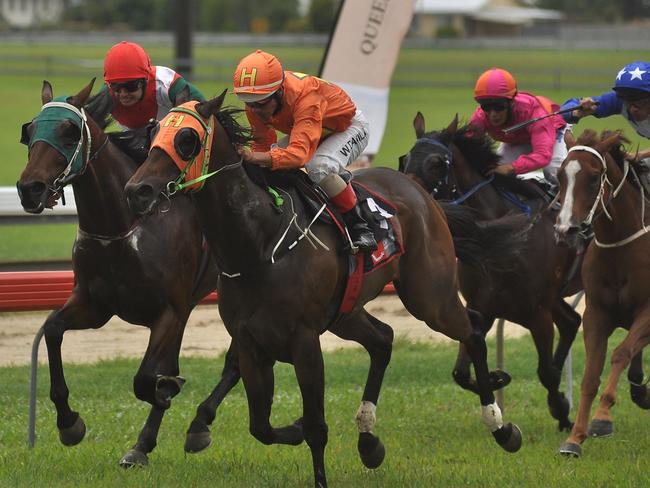 Jockey Wanderson D'Avilla in the colours of Hedley Racing, steers the Roy Chillemi-trained Pink 'n' Blue to victory in race three, the Cassowary Coast Regional Council Class 1 Handicap.