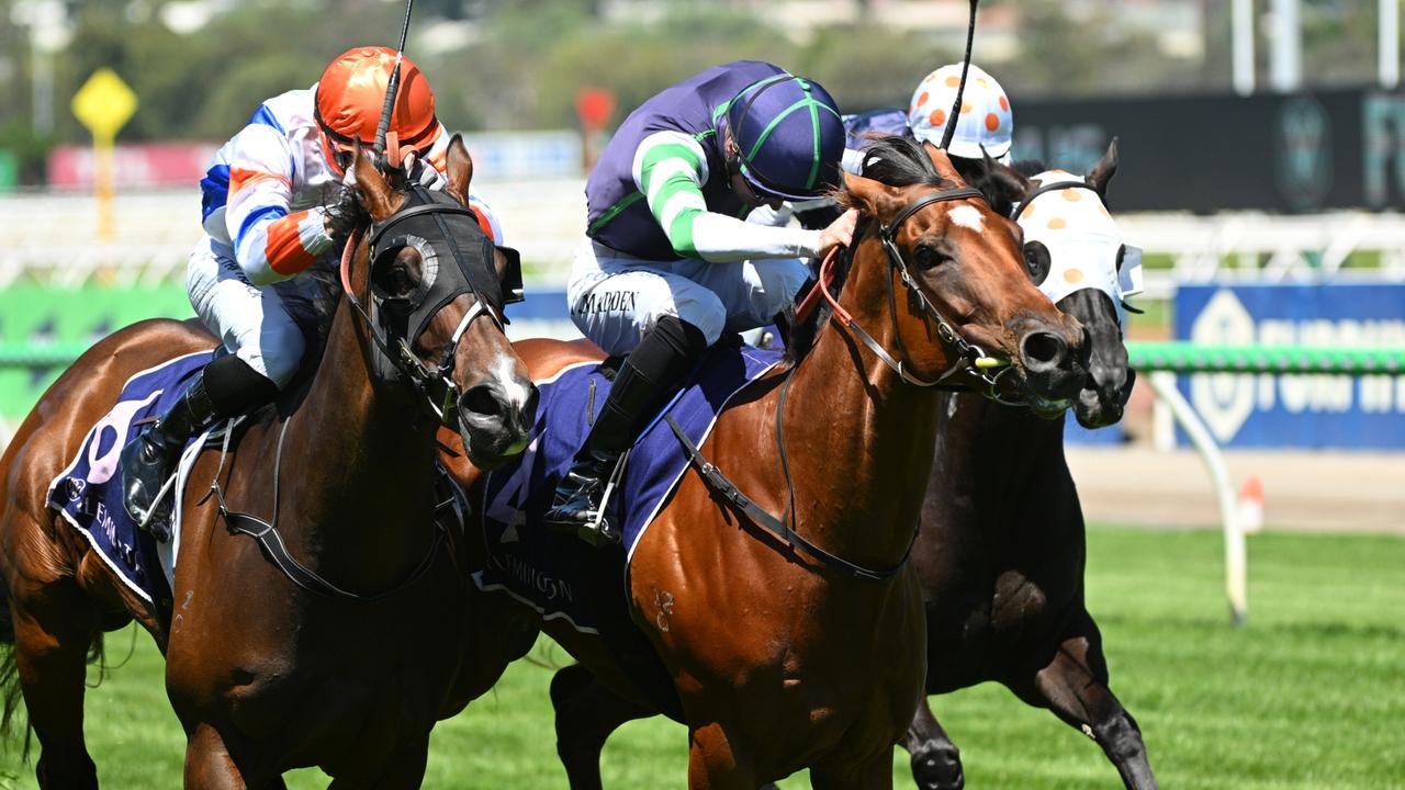 Major Share (right) prevails to give jockey Tom Madden and trainer Adam Chambers their first win at Flemington. Picture: Vince Caligiuri/Getty Images