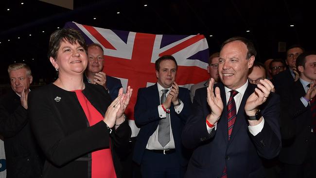 DUP leader Arlene Foster celebrates with DUP deputy leader Nigel Dodds at the Belfast count centre.