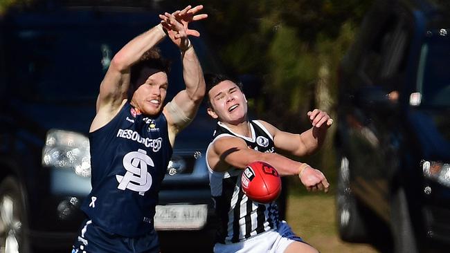 South's Anthony Biemans and Port's Levi Proude compete in the air during their SANFL tenures. Picture: Tom Huntley