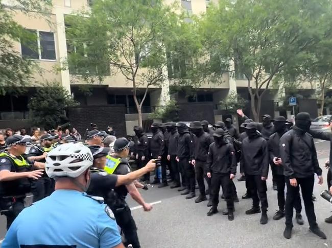 The group was clad entirely in black. Picture: TikTok/permanentvisaforrefugees