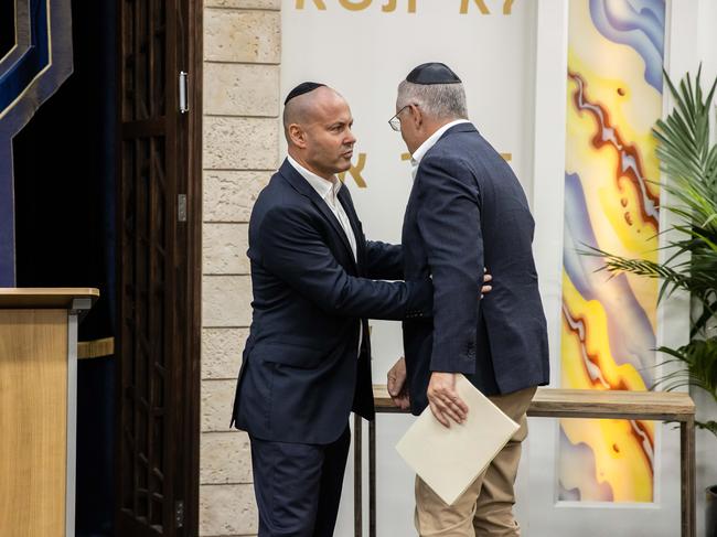 Josh Frydenberg welcomes Prime Minister Scott Morrison at a Passover Service at the Ark Centre Synagogue. Picture: Jason Edward