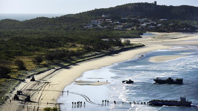 More than 1000 men and women from the armed forces storming the shores of Bowen's Kings Beach in a previous training exercise. Picture: Daniel Wetzel