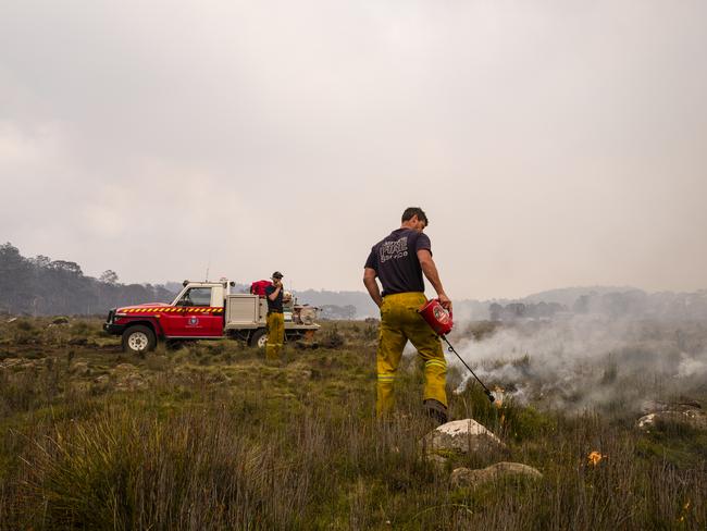 A Tasmania Fire Service crew conducts back burns and create fire breaks in preparation for the unfavourable weather conditions in Miena. Picture: HEATH HOLDEN/Getty Images