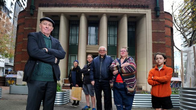 Local residents Martin Mulvihill with Moon Ramone, Sam Weaner, Clynton Cooper-Alyn, Rae Jewell and Alexander Weaner at the community garden at Drill Hall Multicultural Hub, the site of the proposed new safe injecting room. Picture: Andrew Henshaw