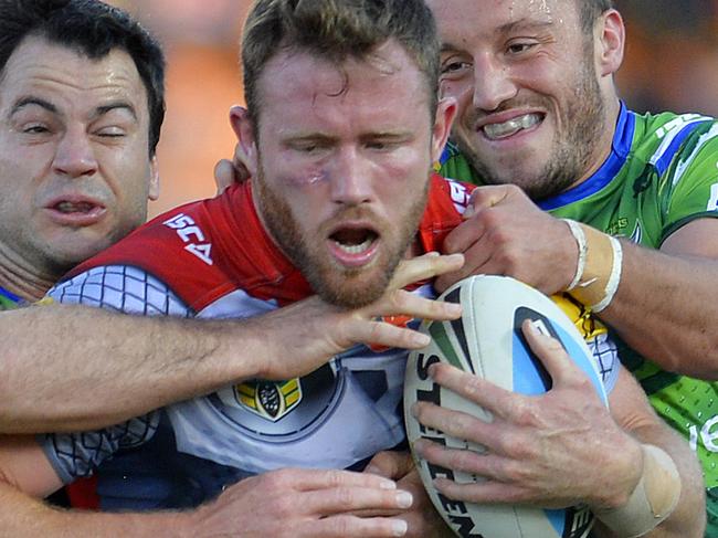 NRL Round 21 match between NQ Cowboys and Canberra Raiders at 1300 SMILES Stadium, Townsville, QLD. Cowboy's Gavin Cooper takes on Raiders Josh Hodgson and David Shillington. Picture: Wesley Monts