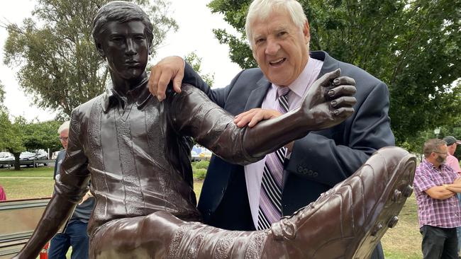 Tasmanian footy legend Peter Hudson with the statue unveiled in his honour. Picture: James Bresnehan