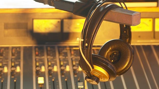 Radio DJ equipment. Headphones. Microphone. Panel. Generic image.