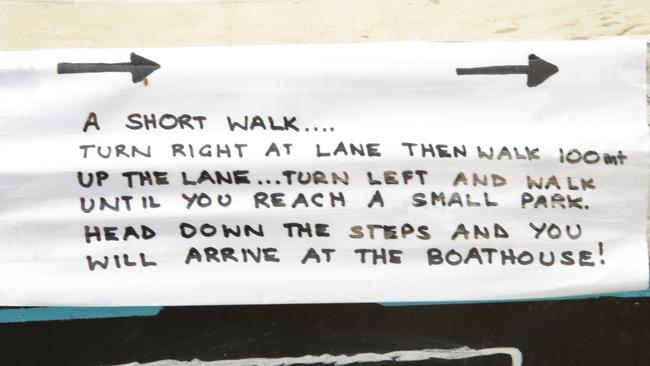 A handwritten note at Fairy Bower points customers towards The Boathouse at Shelly Beach, which is now not accessible via the Manly-to-Shelly footpath.