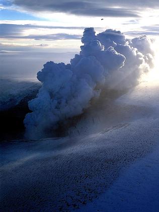 A plane flies over an ash cloud from a volcano eruption in the middle of Vatnajokull, the biggest glacier in Iceland.