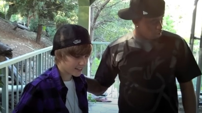 Diddy presents a 15-year-old Bieber with his own car.