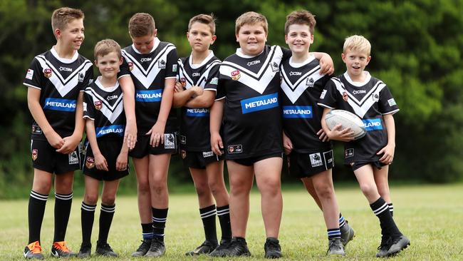 Ourimbah Magpies under-11s (left to right) Logan Walshaw, Kaleb McDonald, Harper Bourke, Keearn Griggs ,Kye Towel, Zavier Donald and Ashton Kain after learning of plans to suspend their rugby league competition. Picture: AAP/Sue Graham