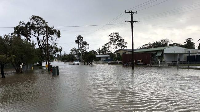 Floodwaters along Wunda Ave at Sussex Inlet. Picture: Sam Strong