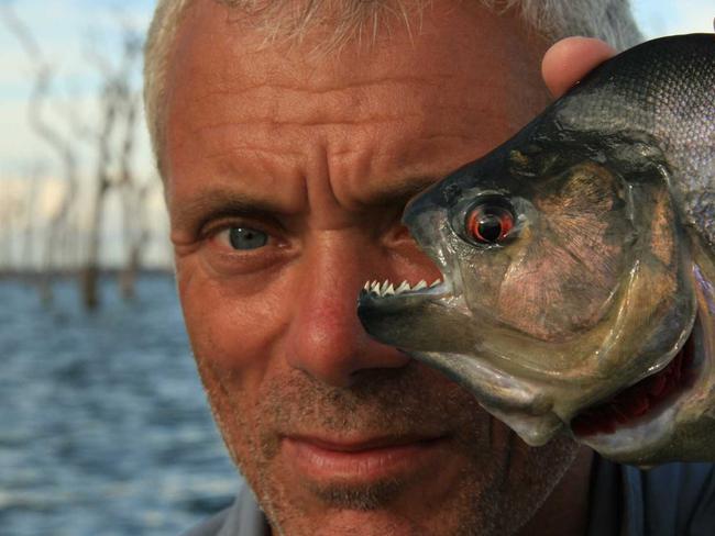 Jeremy Wade with a piranha in <i>River Monsters</i>.