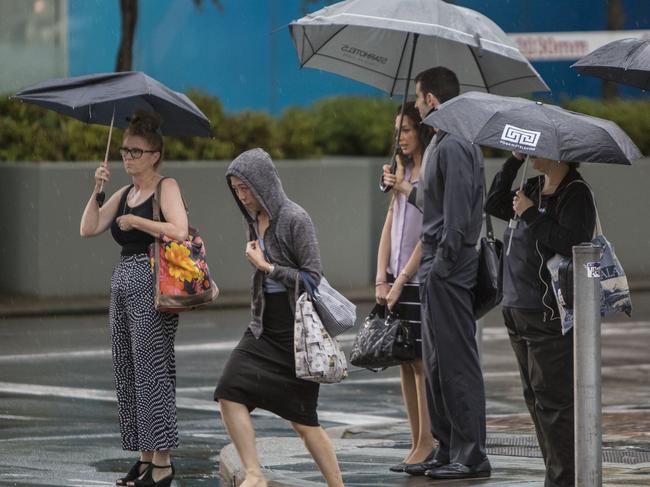 19/12/18 - People crossing Waymouth street, Adelaide in the rain