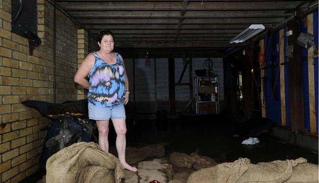 Linda Burley of Kent St, Grafton in her inundated garage.