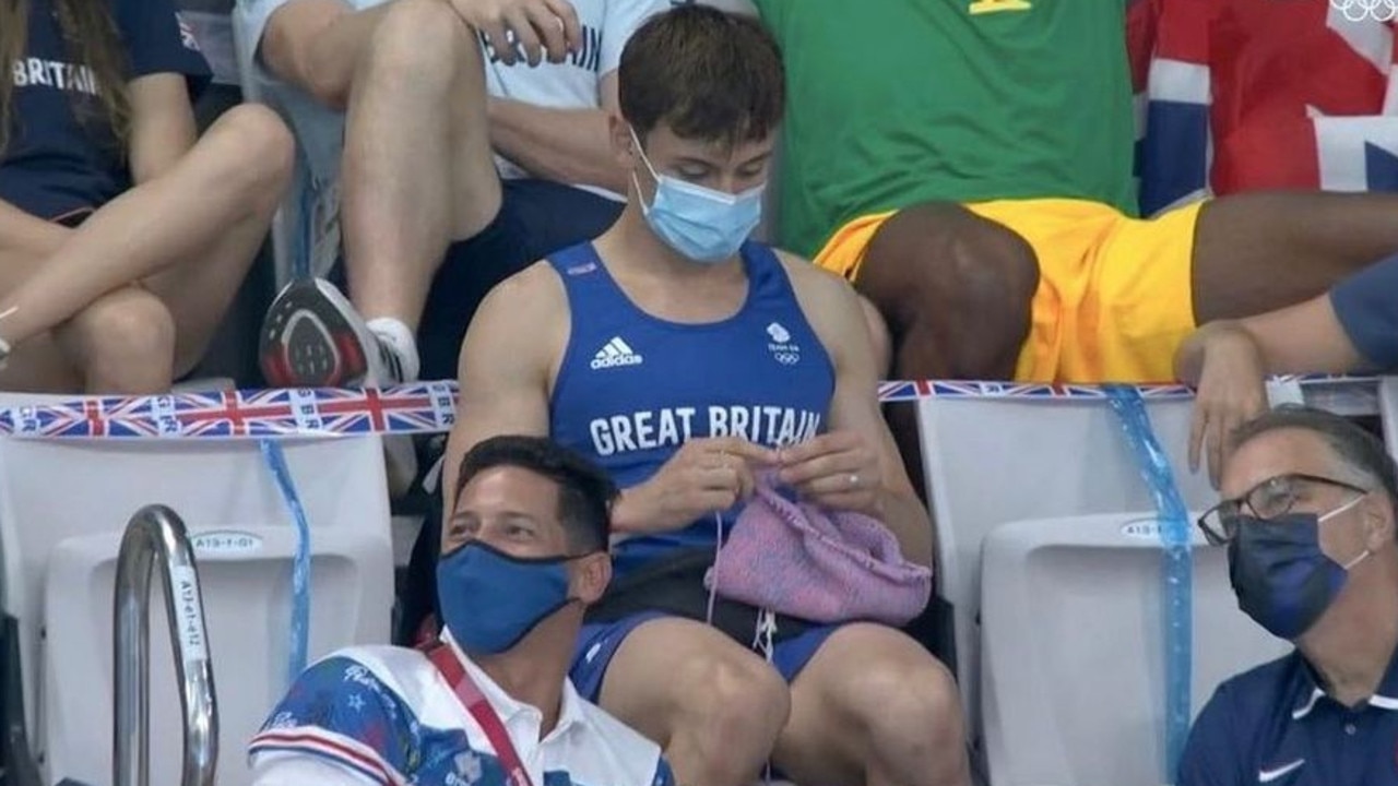 English diver Tom Daley knitting while watching the diving. Picture: Supplied