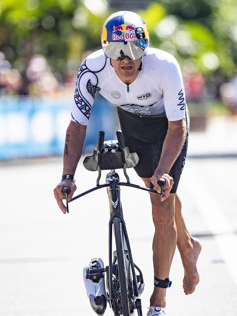 Cairns Iron Man - Braden Currie de-bikes in second place at the endo f the bike leg. Picture: Brian Cassey