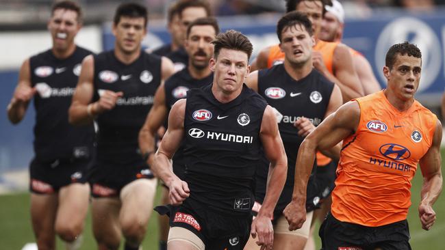 Sam Walsh (centre) and Ed Curnow (right) lead a Blues running drill.