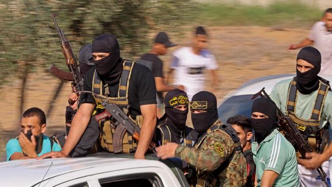 Palestinian militants move towards the border fence with Israel from Khan Yunis in the southern Gaza Strip on October 7, 2023. Linking Palestinian statehood so explicitly to an act of such grotesque barbarity doesn’t just undermine Israel, it also undermines Palestine. Picture: Said Khatib/AFP