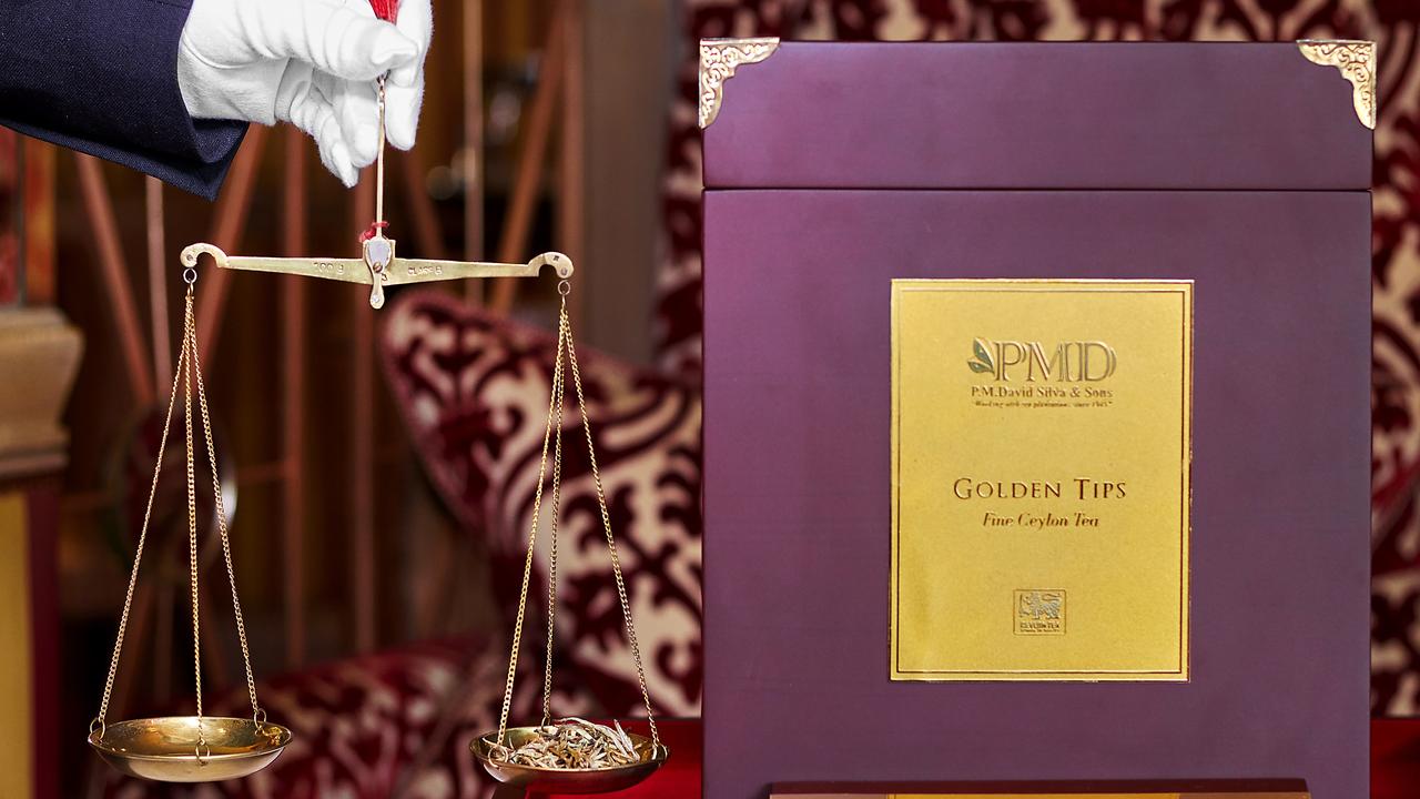 Ceylon Golden Tips on golden scales at your table – each person receives three grams of tea, which will yield around three cups. Picture: Supplied