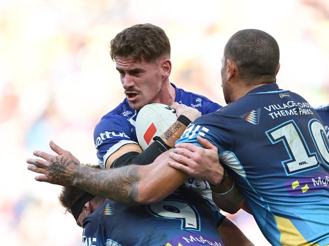 Harry Hayes of the Bulldogs is tackled during the round nine NRL match between the Gold Coast Titans and Canterbury Bulldogs at Suncorp Stadium. (Photo by Hannah Peters/Getty Images)