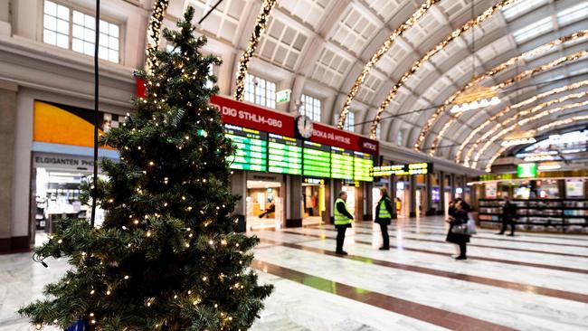 A Christmas tree is seen in a quiet central station in Stockholm. Picture: AFP