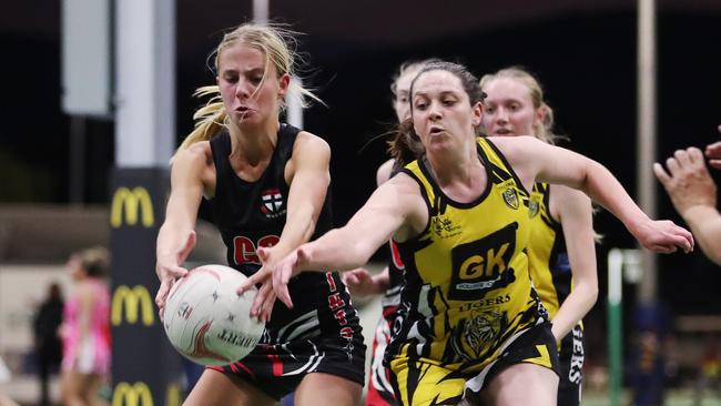 Saints’ Mili Liriges and Tigers’ Jess Thompson fight for possession in the Cairns Netball Association Senior Division 1 match between North Cairns Tigers and Cairns Saints. PICTURE: BRENDAN RADKE