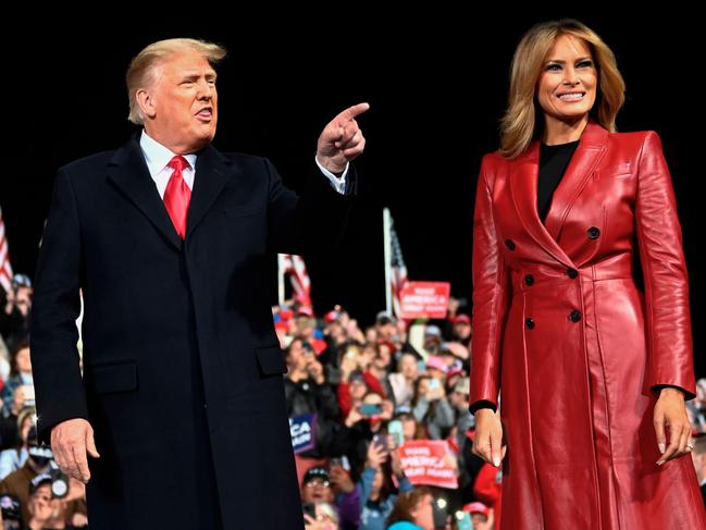 US President Donald Trump arrives with First Lady Melania Trump at the rally. Picture: AFP)