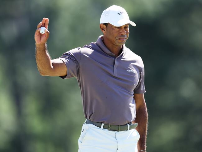 AUGUSTA, GEORGIA - APRIL 12: Tiger Woods of the United States reacts on the 18th green during the second round of the 2024 Masters Tournament at Augusta National Golf Club on April 12, 2024 in Augusta, Georgia. (Photo by Warren Little/Getty Images)