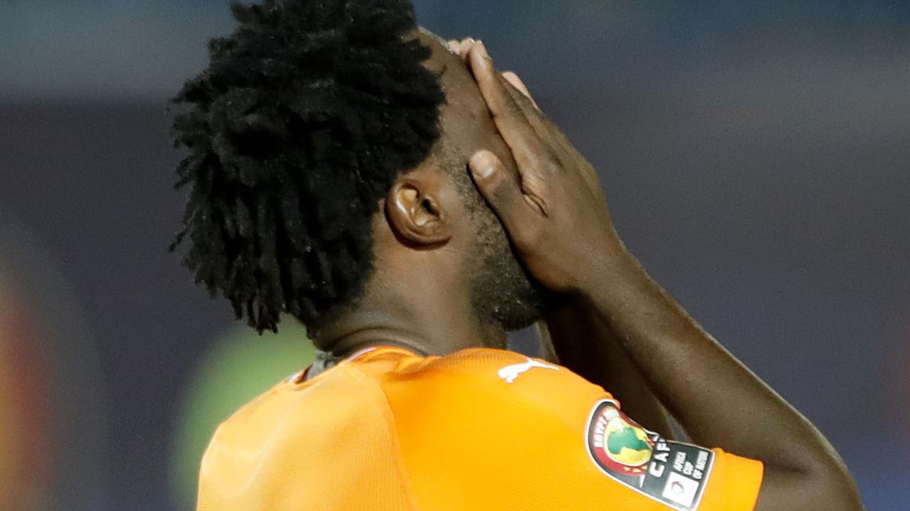 Ivory Coast's forward Wilfried Bony reacts after missing a penalty.