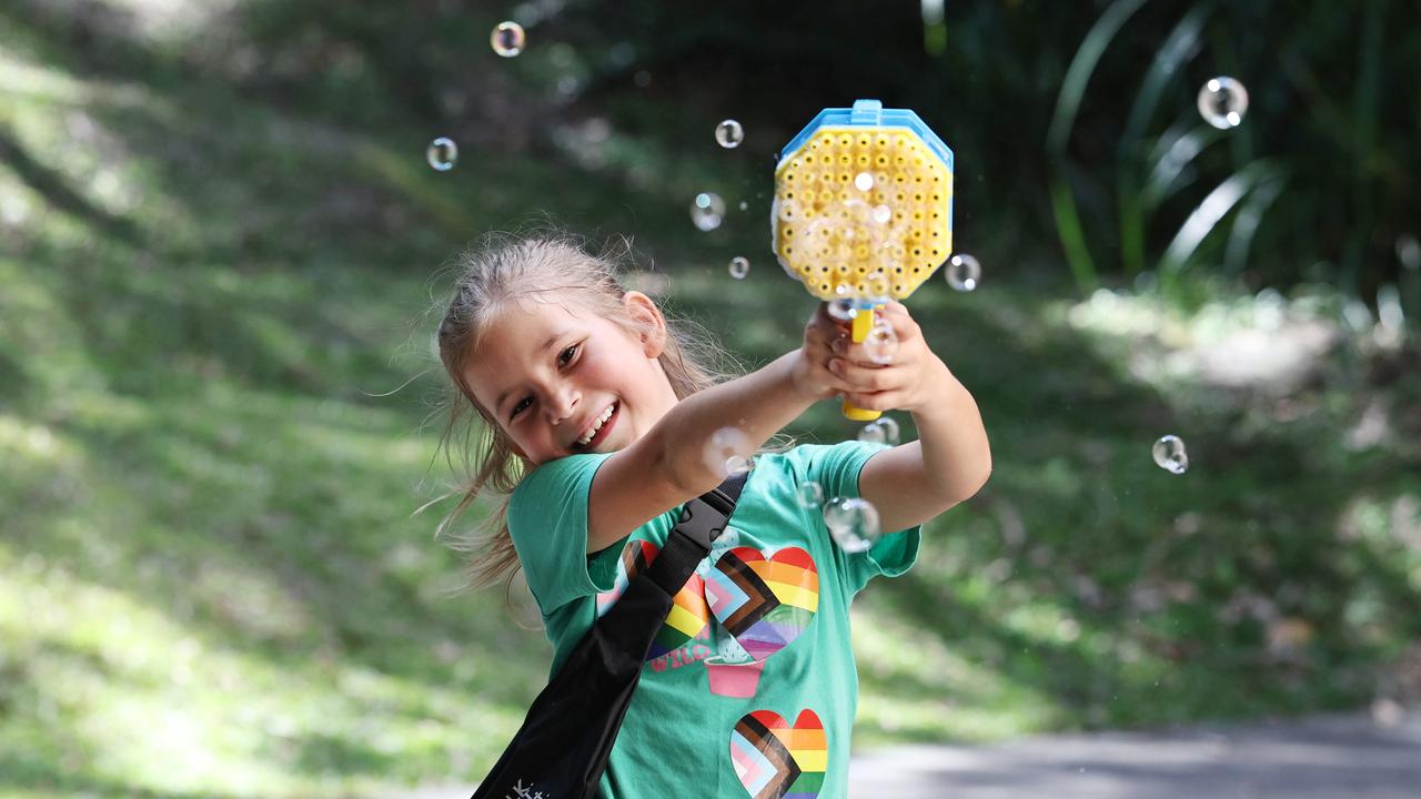 Mackenzie Powman has fun making bubbles at the Cairns Pride Festival's Pride Fair day, held at the Tanks Arts Centre, Edge Hill. Picture: Brendan Radke