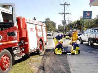 Firefighters monitor petrol vapour levels on Byron Street at Lennox Head yesterday. Picture: Cathy Adams