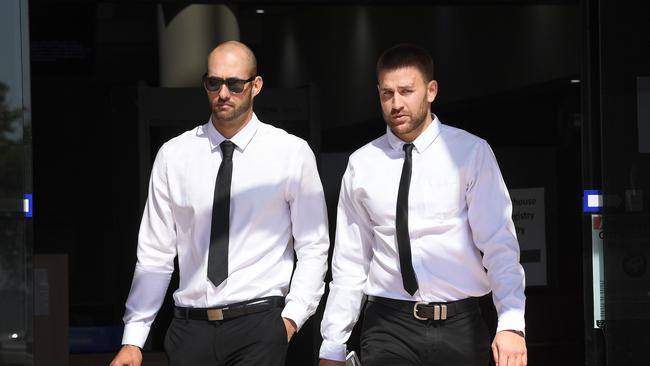 Josh Milani (left) and Sam Wallace leave the Southport courthouse in Southport on the Gold Coast, Tuesday, August 21, 2018. (AAP Image/Dave Hunt)