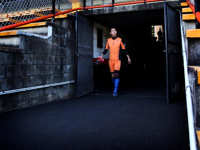 Ri Myong-Guk, goal keeper of the North Korea football team, emerges during a training session at Leichhardt Oval ahead of their opening Asian Cup match. Picture: Richard Dobson