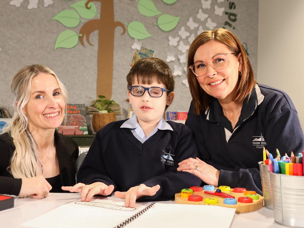 Blind since birth, Declan Lee is the Bee's first-ever braille-assisted young Bee, participating in the school round with the help of his teaching team and special braille keyboard. Declan is pictured centre with class teacher, Narelle Drew, left, and education support office Carolyn Jones. Picture: Supplied