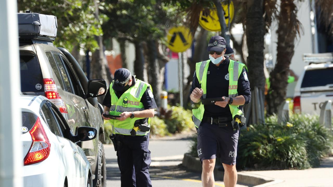 Police conducting lockdown compliance checks at Mooloolaba on the Sunshine Coast. Picture: Lachie Millard.