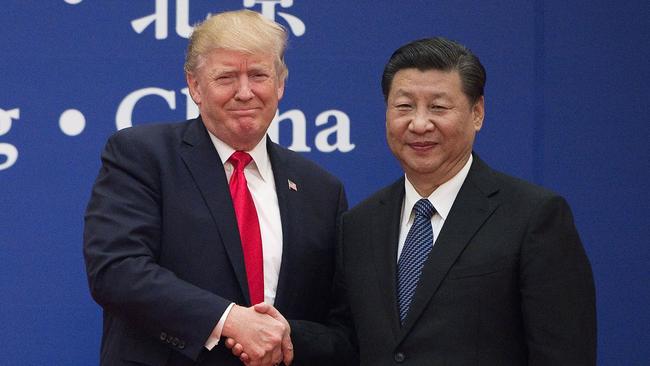 Then US president Donald Trump and China's President Xi Jinping shaking hands during a business leaders event at the Great Hall of the People in Beijing on November 9, 2017. Picture: AFP