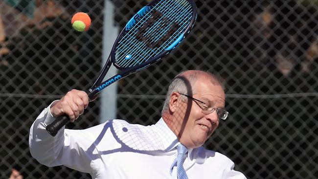 Scott Morrison having a hit of the tennis ball during a 2019 campaign stop. Picture Gary Ramage