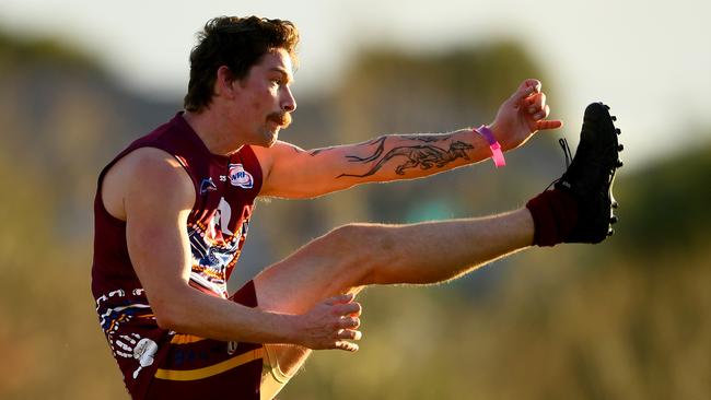 Joshua Stone of Tarneit kicks during the round eleven 2023 Rookie Me Division 3 Seniors match between Tarneit and West Footscray at Wootten Road Reserve in Tarneit, Victoria on July 1, 2023. (Photo by Josh Chadwick)