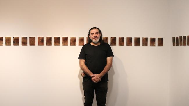 Khaled Sabsabi with his works at Mosman Art Gallery.