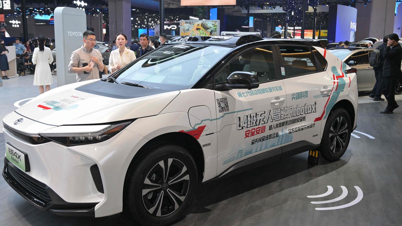 A Toyota Robotaxi is displayed during the 21st Shanghai International Automobile Industry Exhibition at the National Exhibition and Convention Center in Shanghai on April 23, 2025. (Photo by Hector RETAMAL / AFP)
