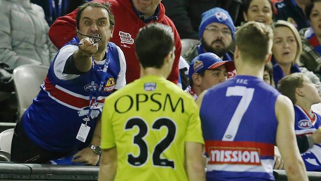 A Bulldogs fan gives an umpire a piece of his mind. Picture: Michael Klein