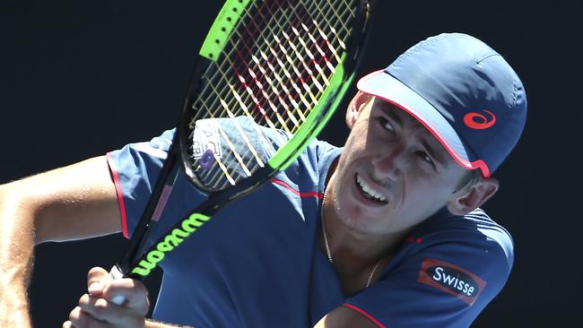 Alex de Minaur from Australia plays a shot to Gilles Simon from France during their men's semi-final match at the Sydney International tennis tournament in Sydney, Australia, Saturday, Jan 12, 2019. (AP Photo/David Moir)